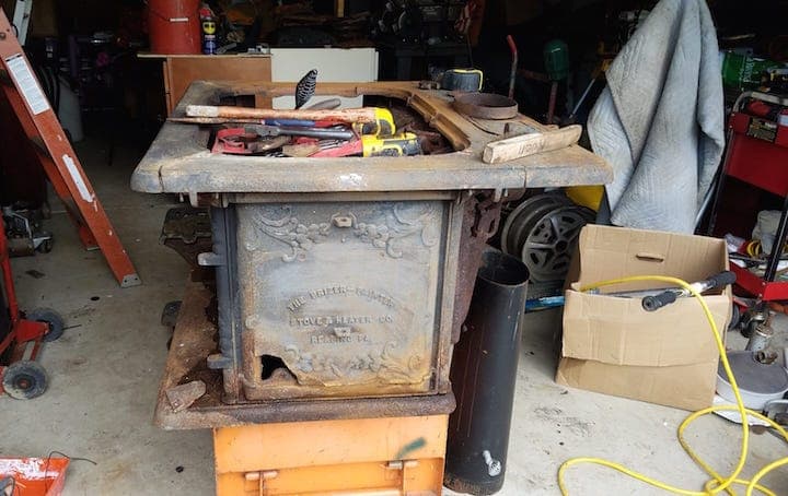 Not cast iron cookware, but an old stove that's been used as a back up, for  when power goes our, and a fireplace. An Olympic model from Washington stove  works. Hope you