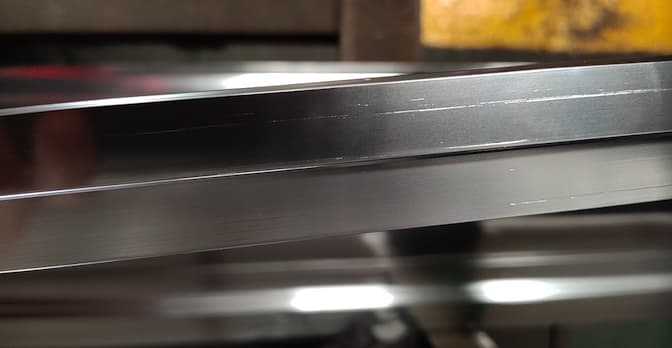 tearing defect in bright dipped aluminum