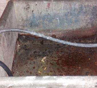 zinc utility sink with corroded hole 2