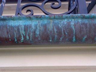 copper gutters with sprayed on patina solution 2