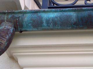 copper gutters with sprayed on patina solution 5